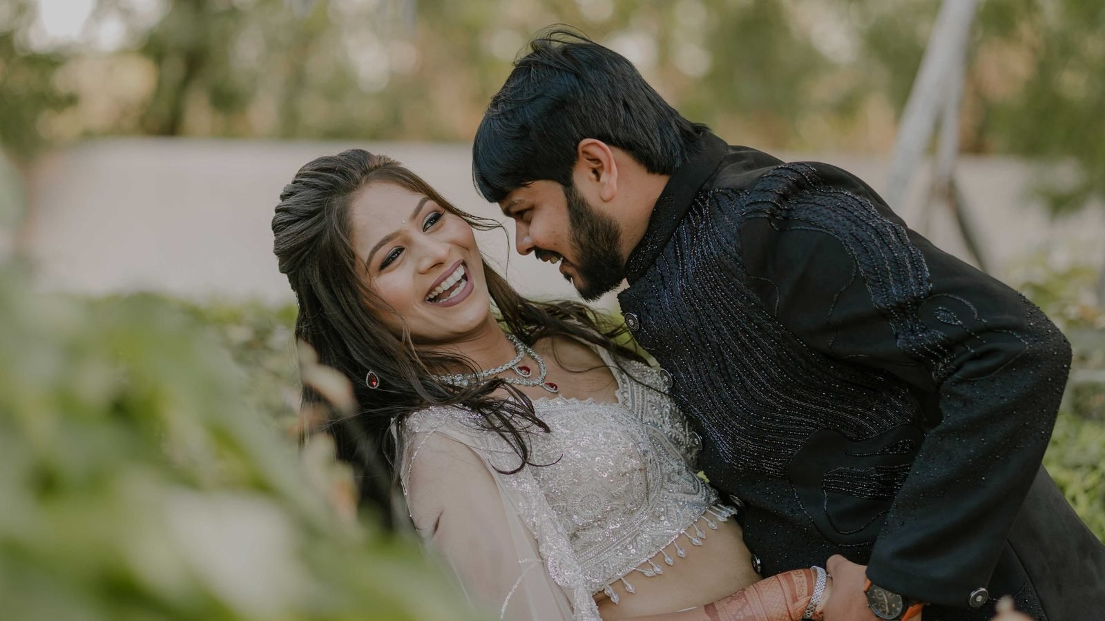 Bride and groom laughing together