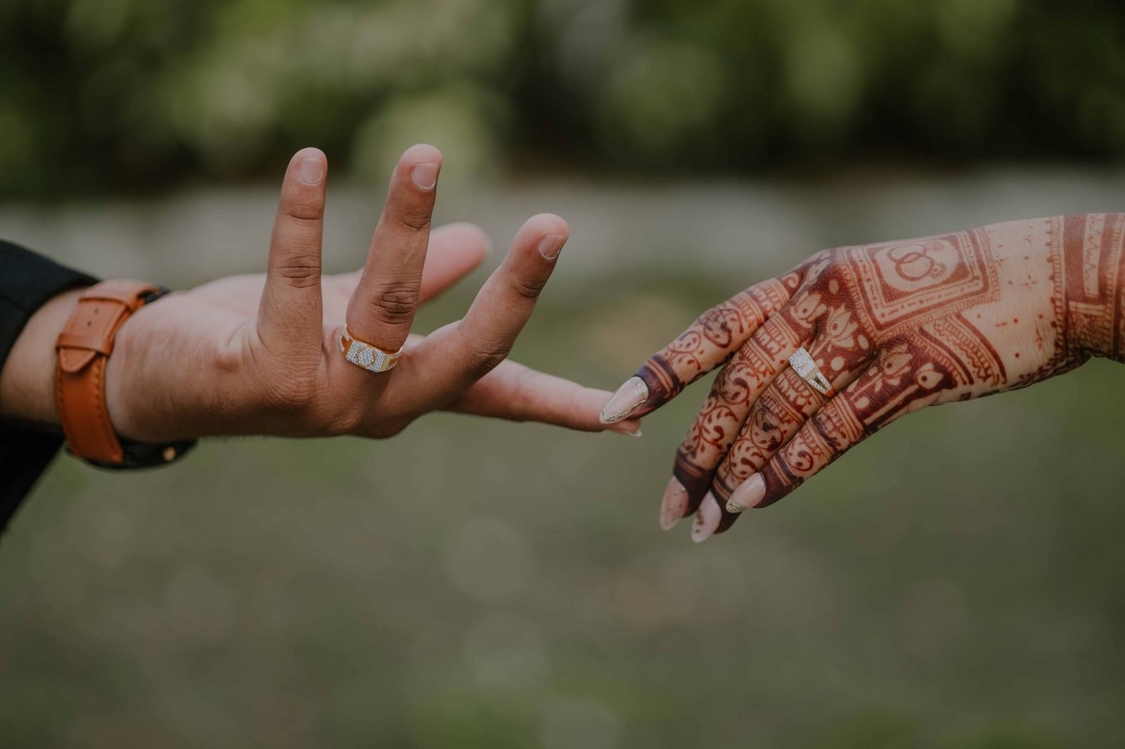 Bride and groom hands with rings