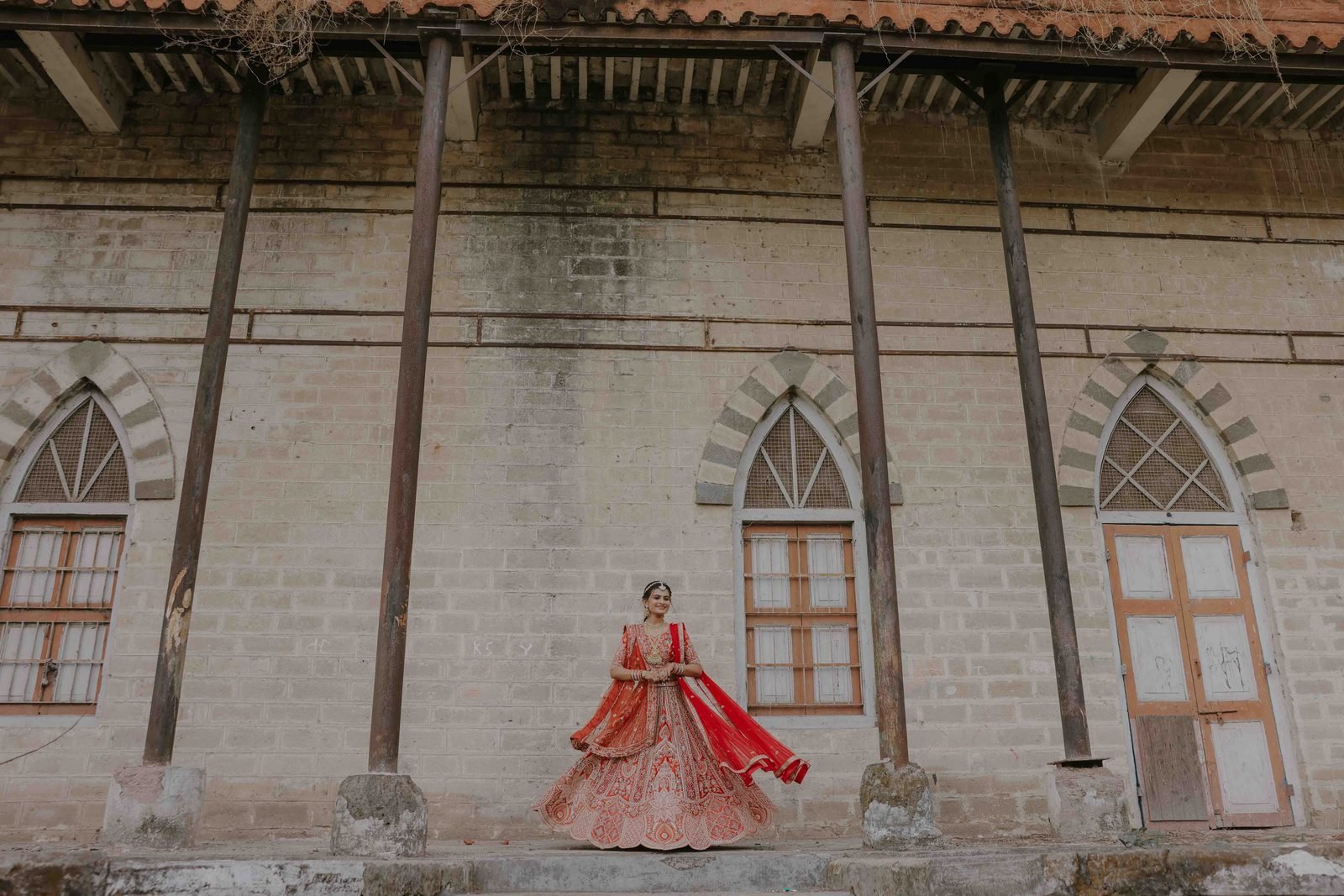 Bride in red lehenga twirling