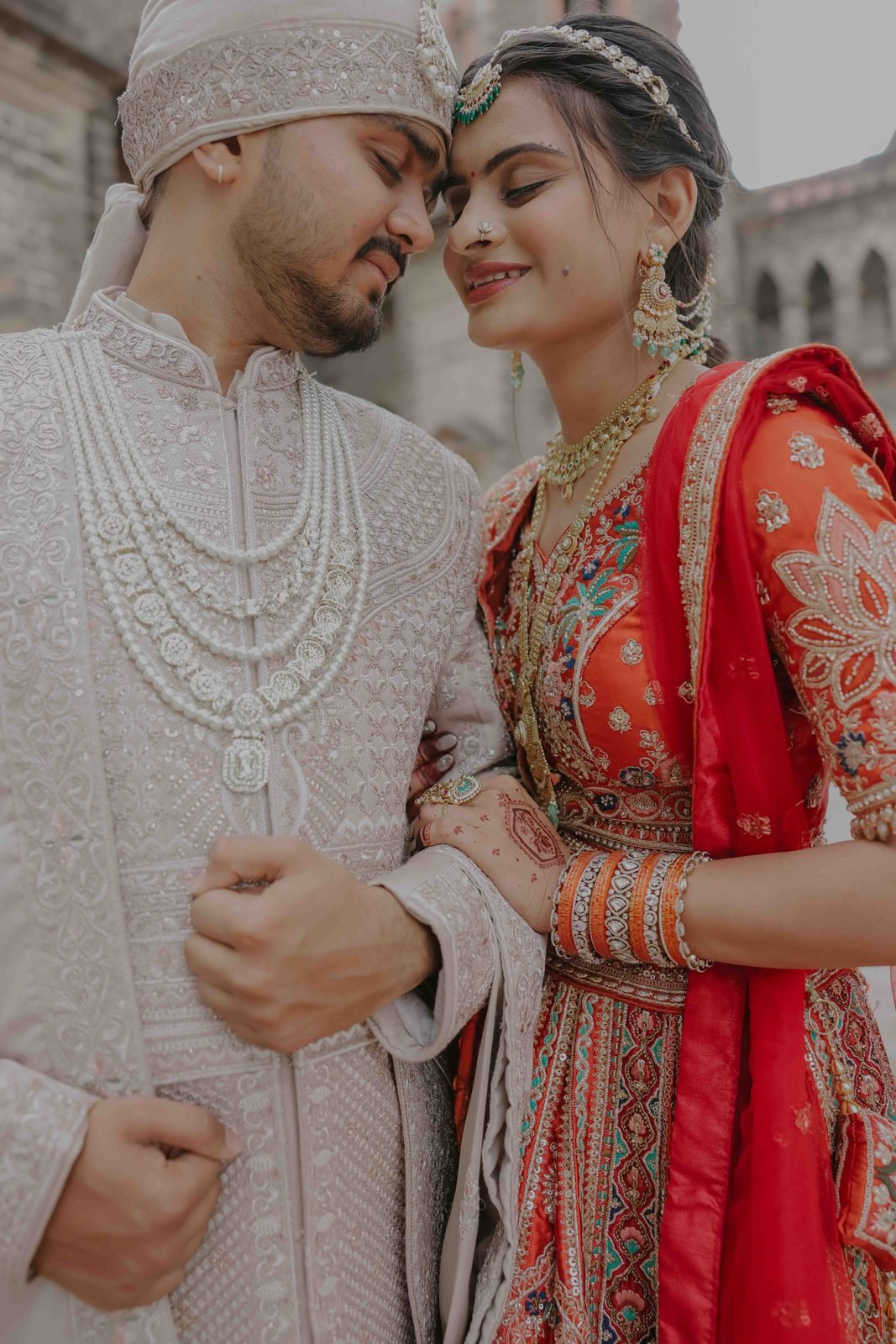 Bride and groom, foreheads touching, from a Film India Studio wedding